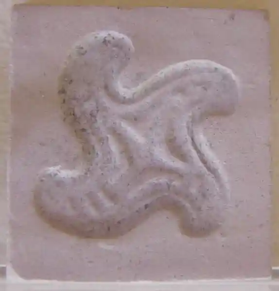 Hermatite and faience seals, rounded swastika